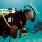 Maldivian President Mohammed Nasheed arrives for an underwater meeting of the Maldives' Cabinet (AP Photo/Mohammed Seeneen).