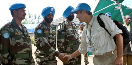 January 2008, George Clooney, appointed UN Messenger for Peace, shakes hands with a member of the Indian Battalion of the United Nations Organization Mission in the Democratic Republic of the Congo, during his tour of the UN Peacekeeping Missions in Africa. (UN Photo/Marie Frechon)
