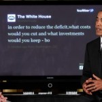 President Barack Obama sits with Twitter co-founder and Executive Chairman Jack Dorsey in front of a screen displaying the question he tweeted during a "Twitter Town Hall". (AP Photo/Charles Dharapak)