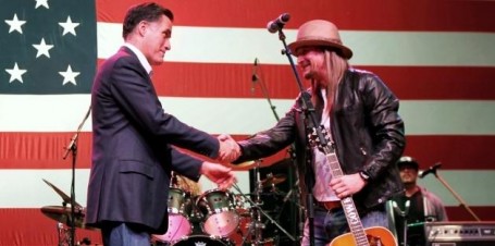 Republican presidential candidate, Mitt Romney shakes hands with musician Kid Rock at a campaign rally. (AP Photo/Gerald Herbert)